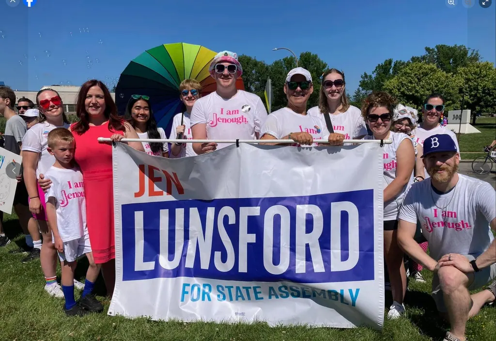 Volunteers holding a Lunsford for State Assembly banner at an outdoor event